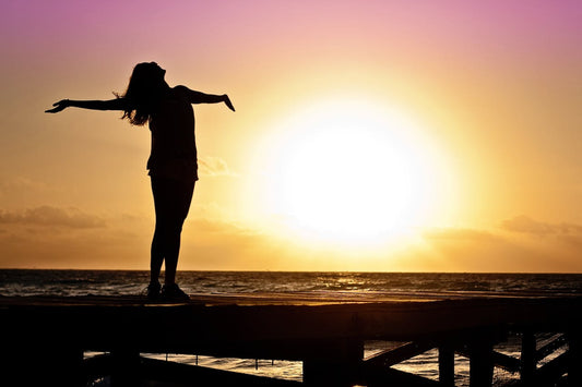 Happy women standing after taking Flowstate Lion's mane mushroom extract